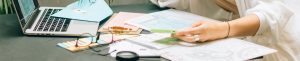 Office desk, forms, calculator, laptop, ncr forms